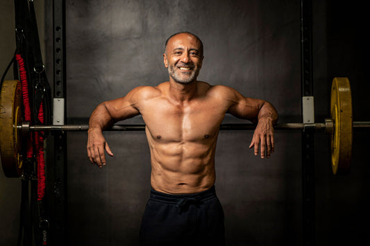 Building Muscle as You Age. An older man preparing to perform squats.