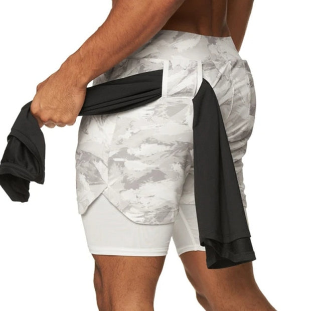 One of the scariest feelings is losing your phone, wallet, or keys at the gym when working out. If your pockets aren’t secure things can slide out easier than you think. Well, now you can workout worry-free of losing your belongings with our Men’s Quick Drying Fitness Shorts. Side compression pockets keep your phone and wallet secure the entire time you're working out. The fabric is a stretchy spandex blend that lends you the freedom to work out comfortably and unrestricted!